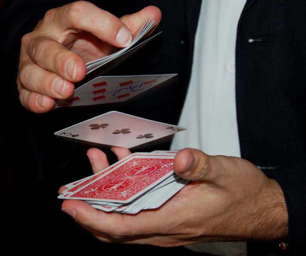[Image: Website-Commercial-Magician-shuffling-cards.jpg]